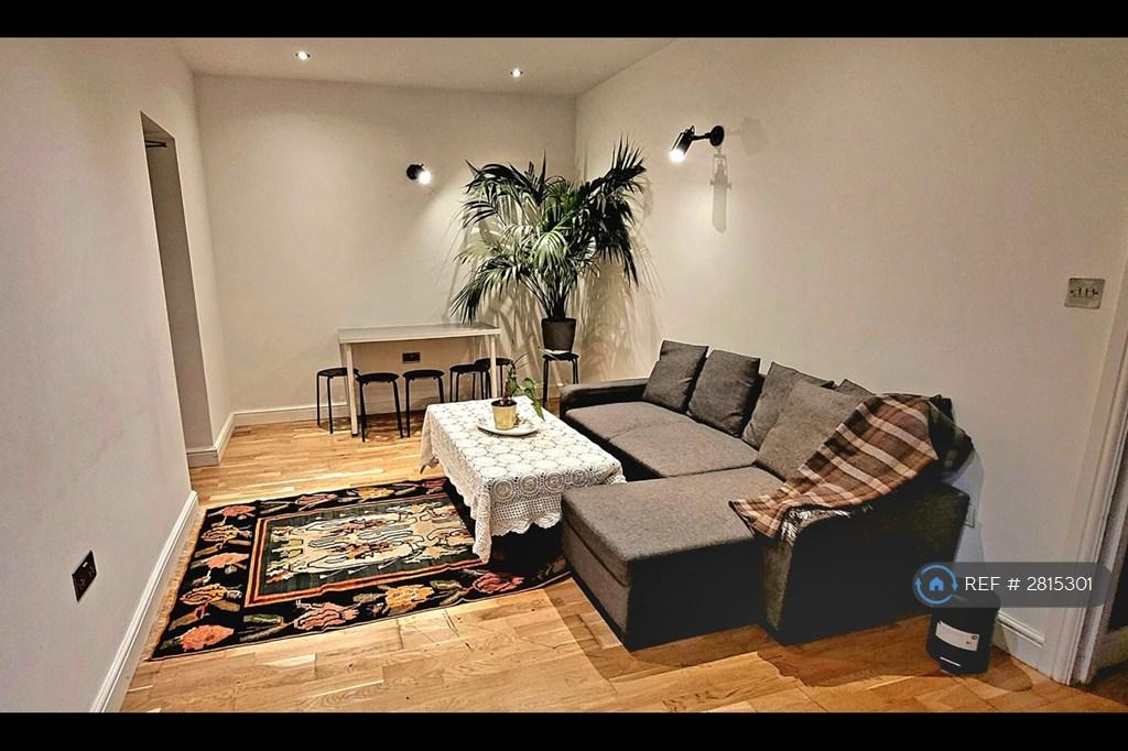 Living Room With a Sofa And Dining Table