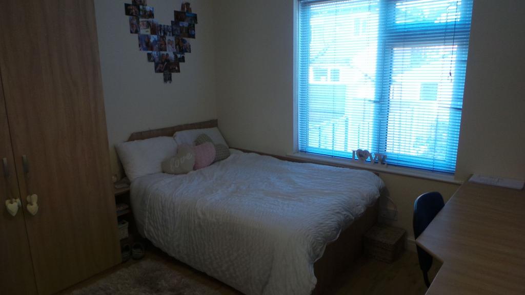 A cozy bedroom featuring a double bed with deco...