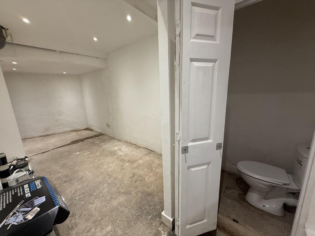 Basement room 2 leading to entrance from rear and