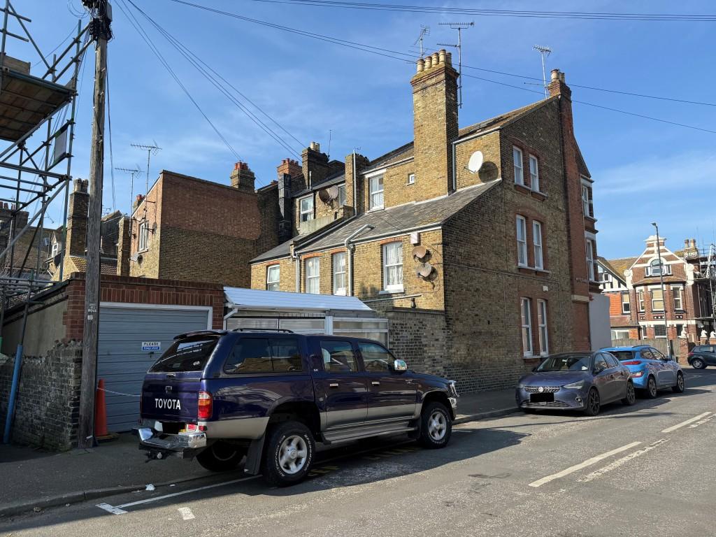 Rear of property showing garage and carport