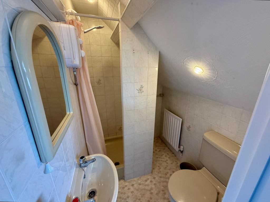 Loft room en-suite shower room with W.C.