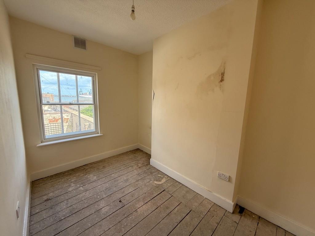 Bedroom one with window to front and view towards