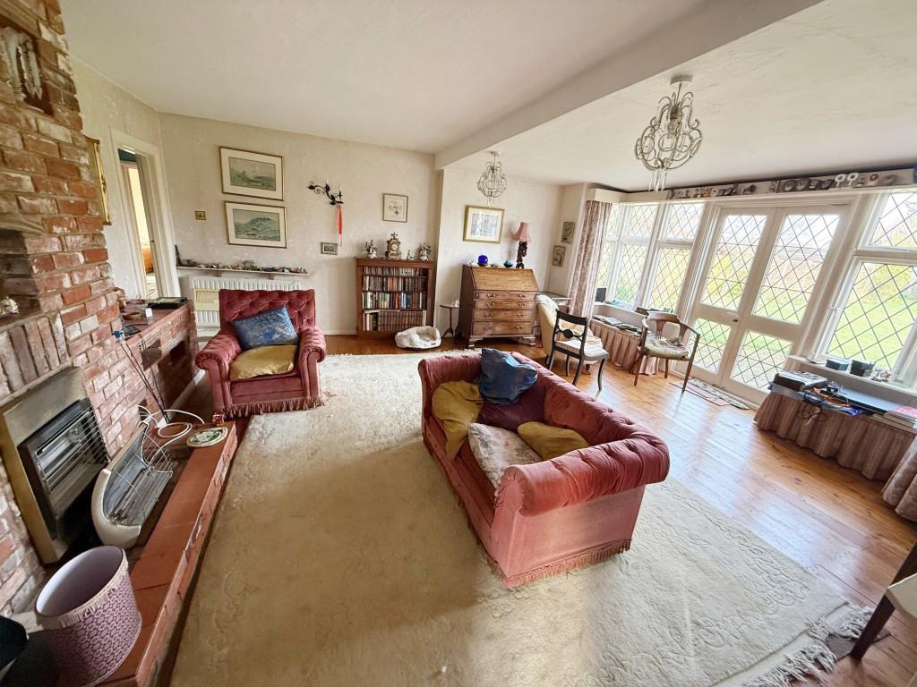 Living room with fireplace and French doors to gar