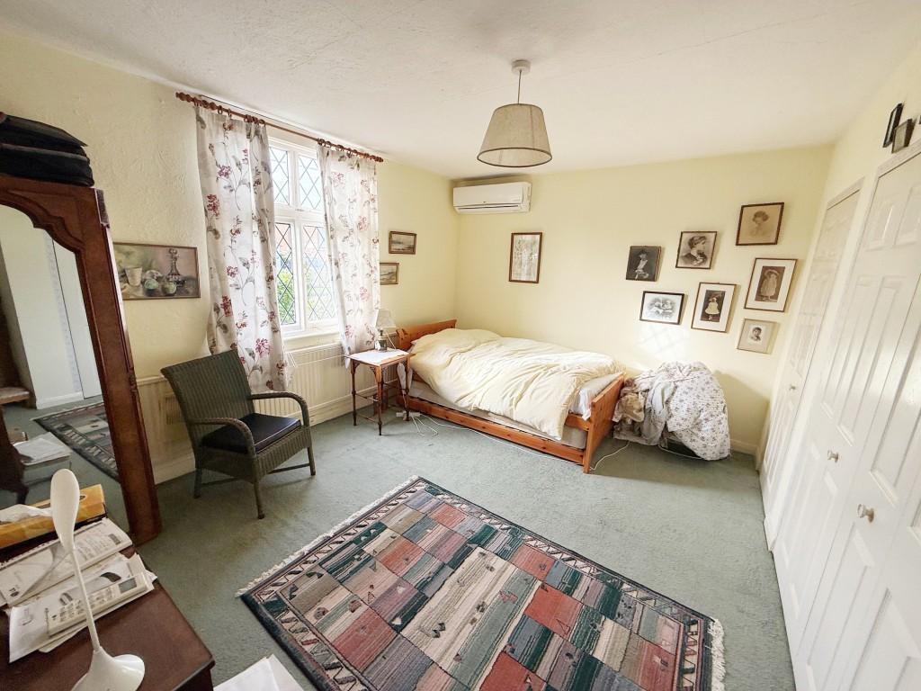 Bedroom two with wardrobes and window to the front