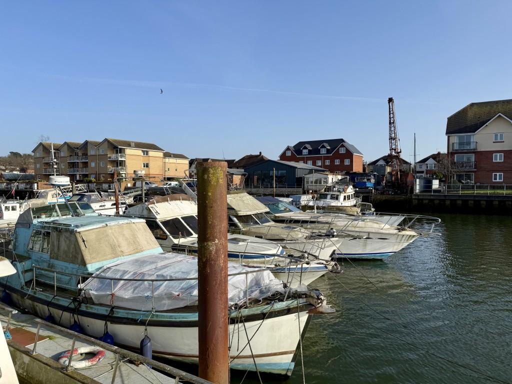 Pontoon with boat yard in the background