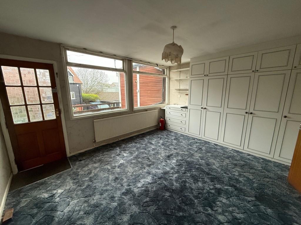 Bedroom one with access to side balcony
