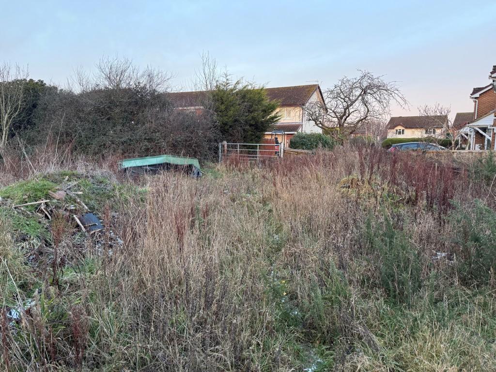 View of land from south showing gated access