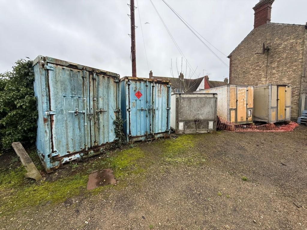 Left side of land showing containers