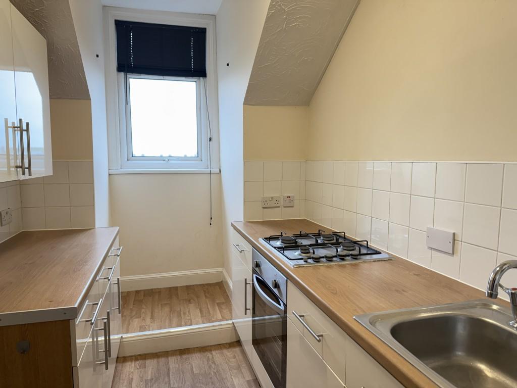Fitted kitchen units with window to street
