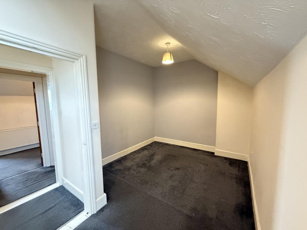 Living room with neutral colours and grey carpet