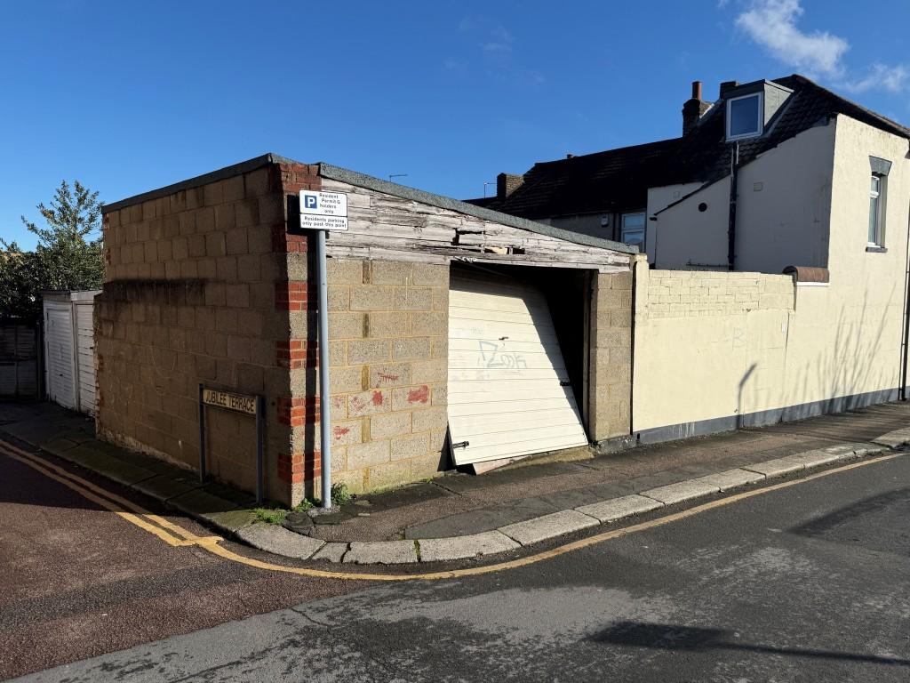Detached garage and adjacent land