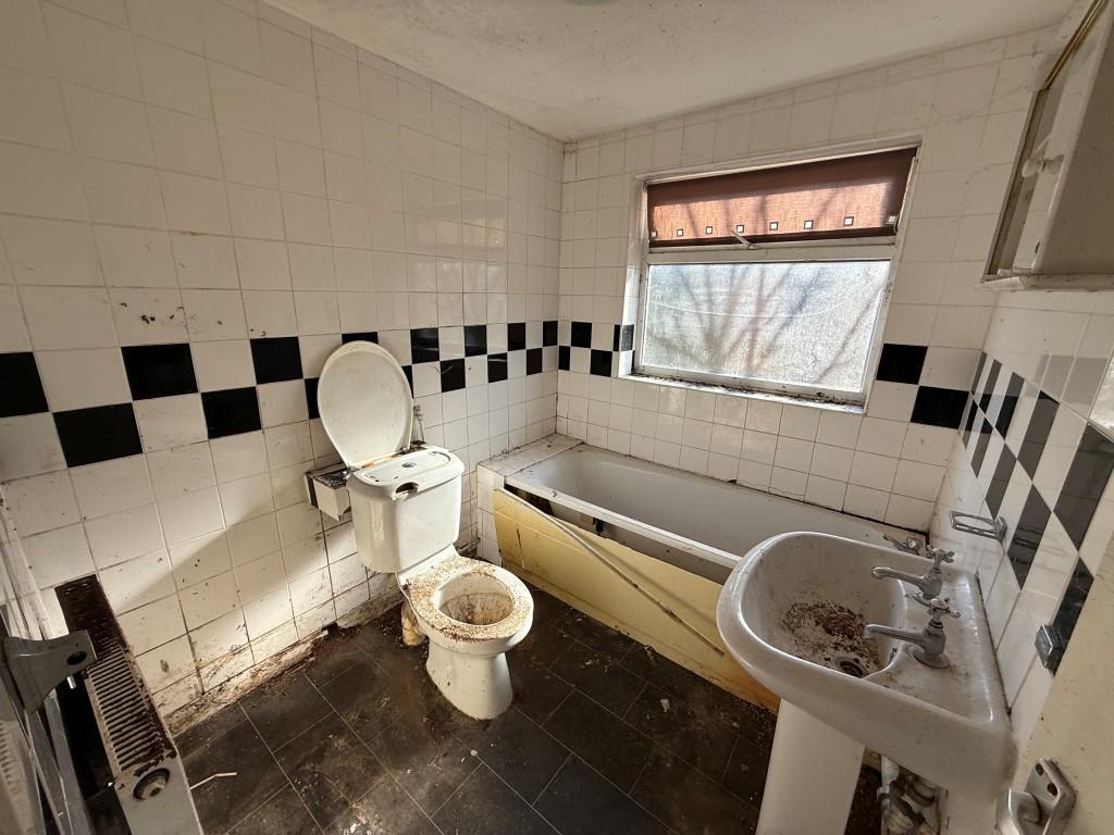 Tiled bathroom with window