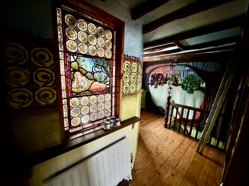 Landing with stain glass window