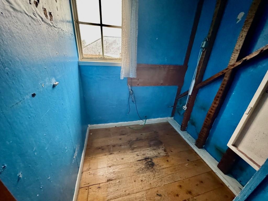First floor study and former W.C. room