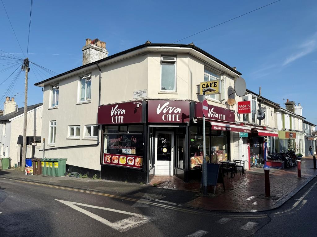 Corner property comprising café and flat
