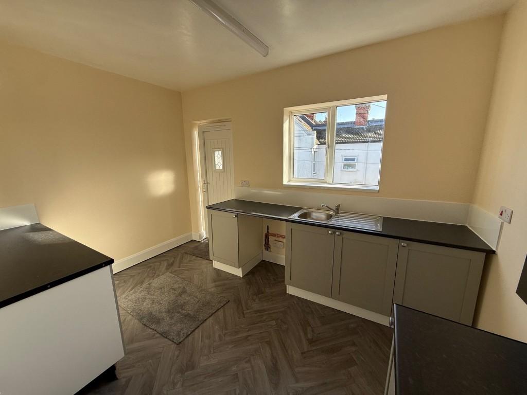 Alternative view of kitchen with window to rear