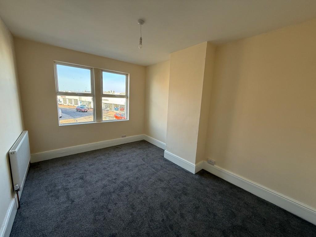Bedroom one with two windows to the front