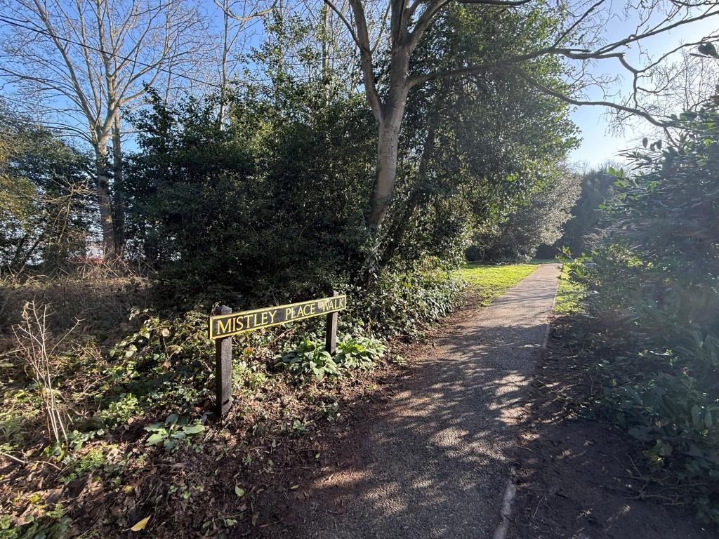 Footpath sign leading to land
