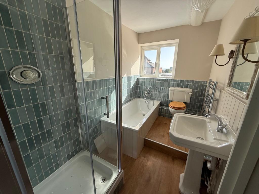 Bathroom with bath and shower