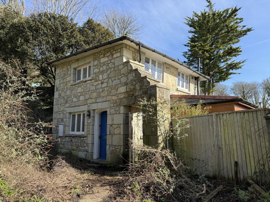 Detached stone wall effect house