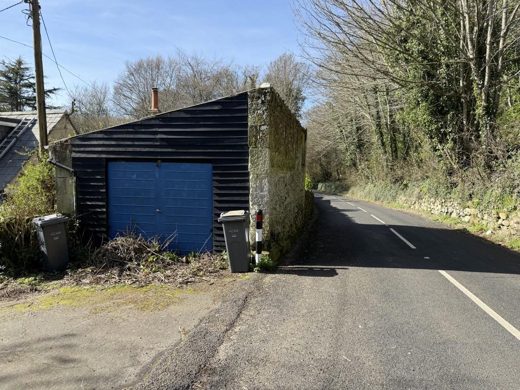 View of detached garage and Undercliff Drive
