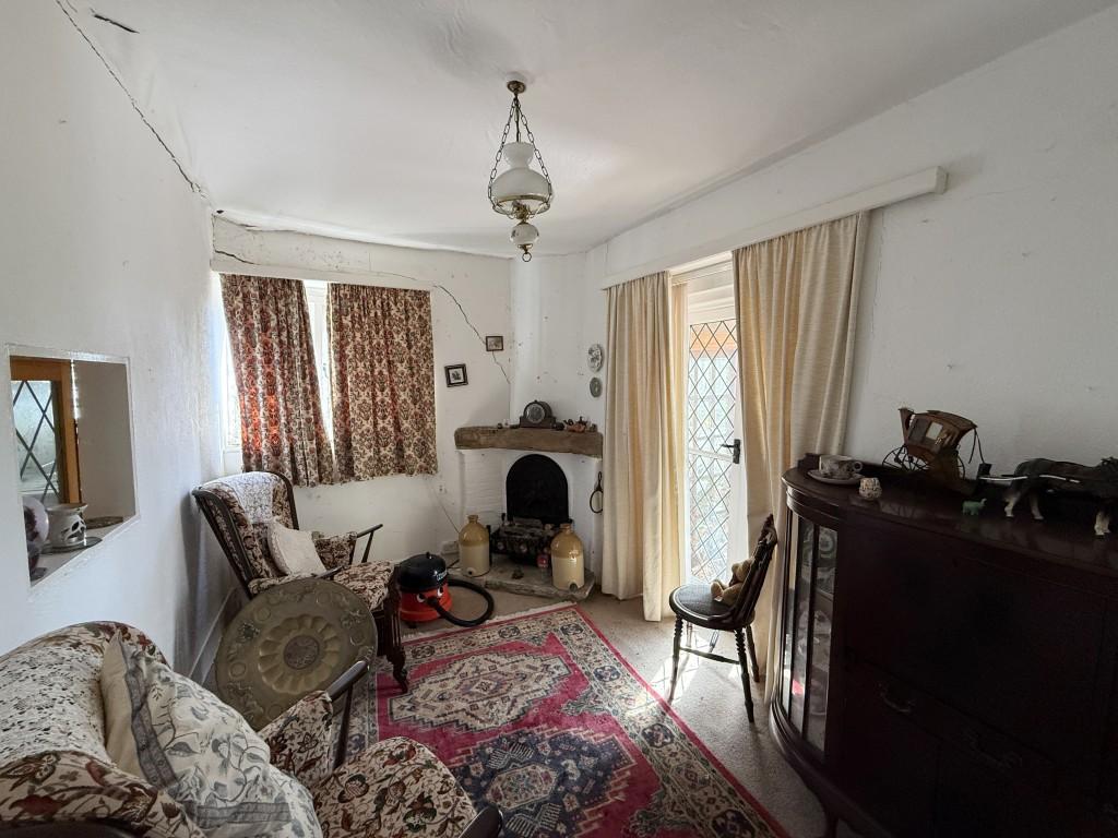 Living room with doors to conservatory