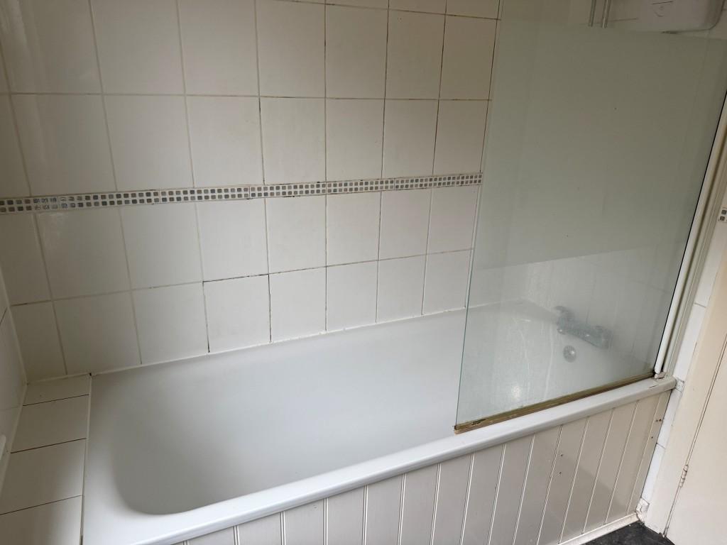 White bathroom suite with shower