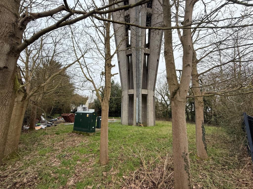 Back view into building and land from field