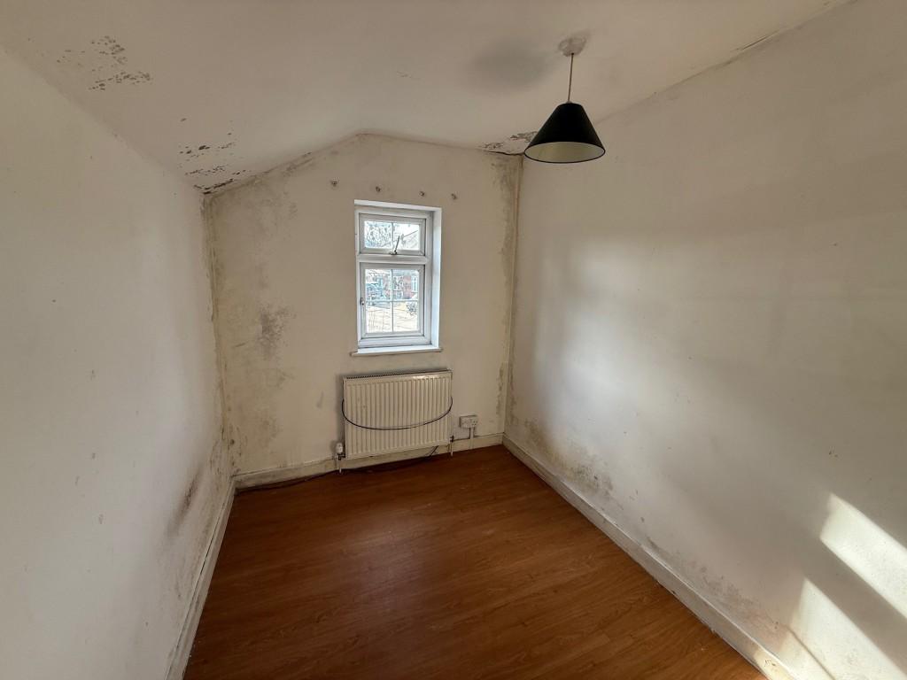 Bedroom three with window to rear of the house