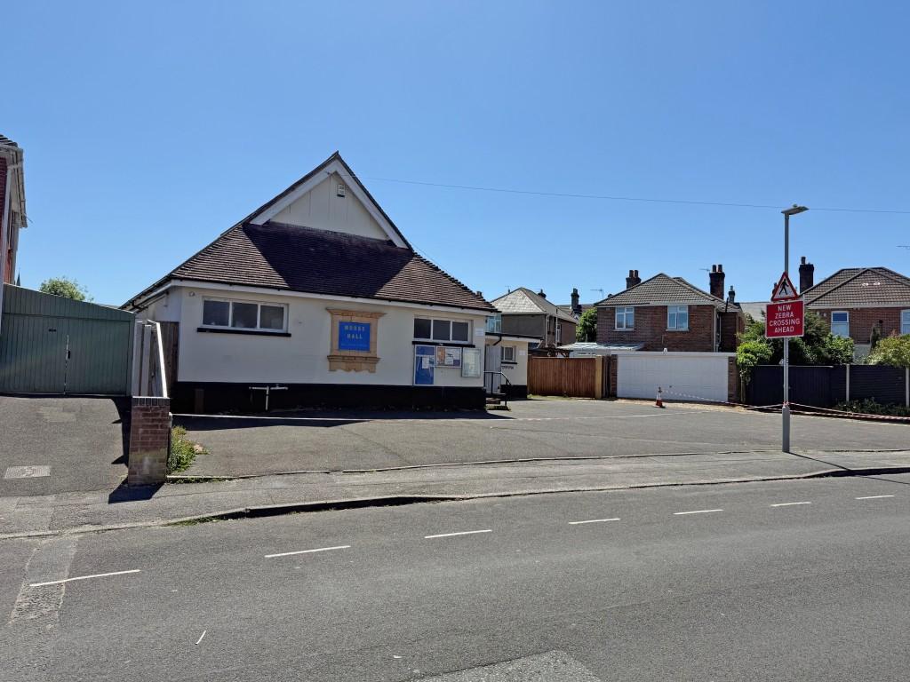 Outside view of the building with large road front