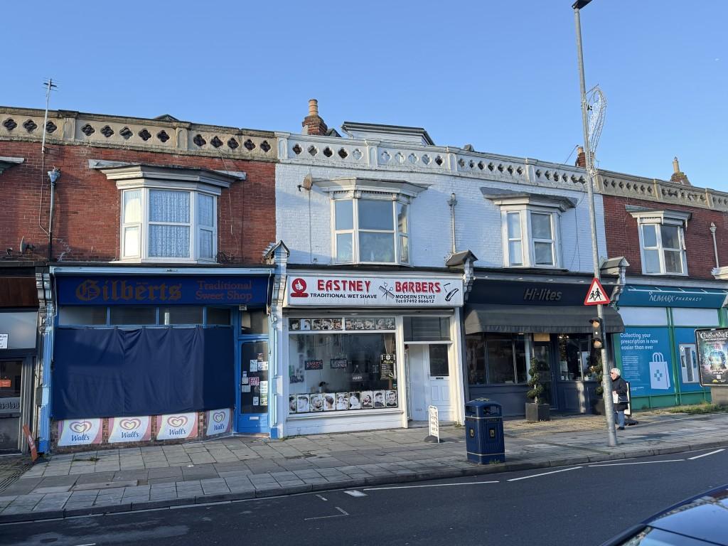 Front view of maisonette above barbers on main roa