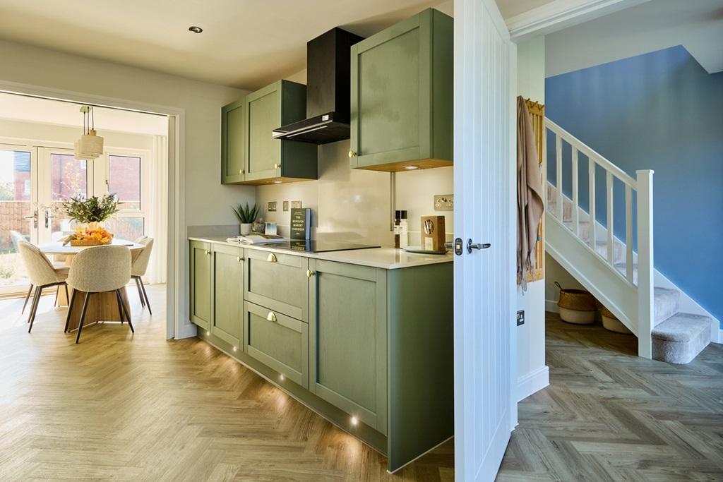 The modern kitchen is light and has ample...
