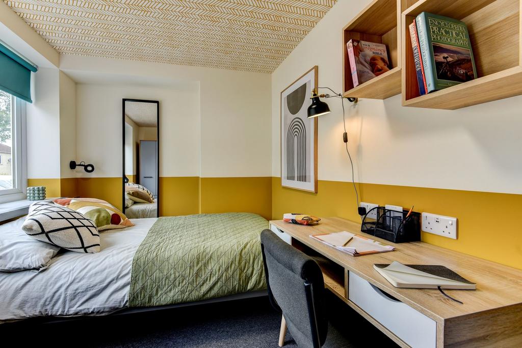 Bright, modern bedroom with a neatly made doubl...