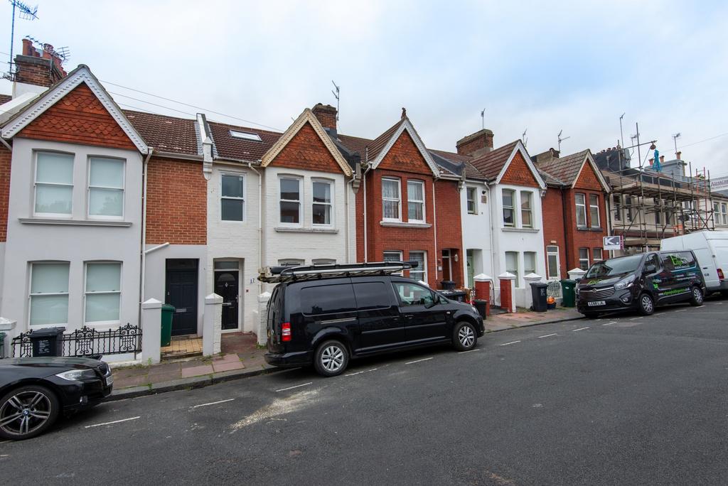 Row of well-maintained Victorian-style terraced...