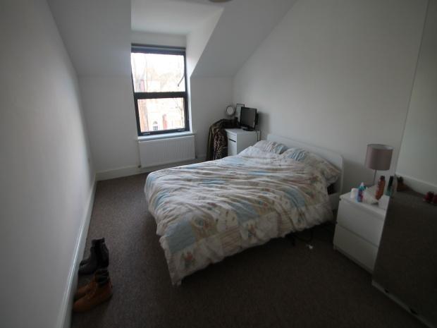 Cozy bedroom with double bed and window...