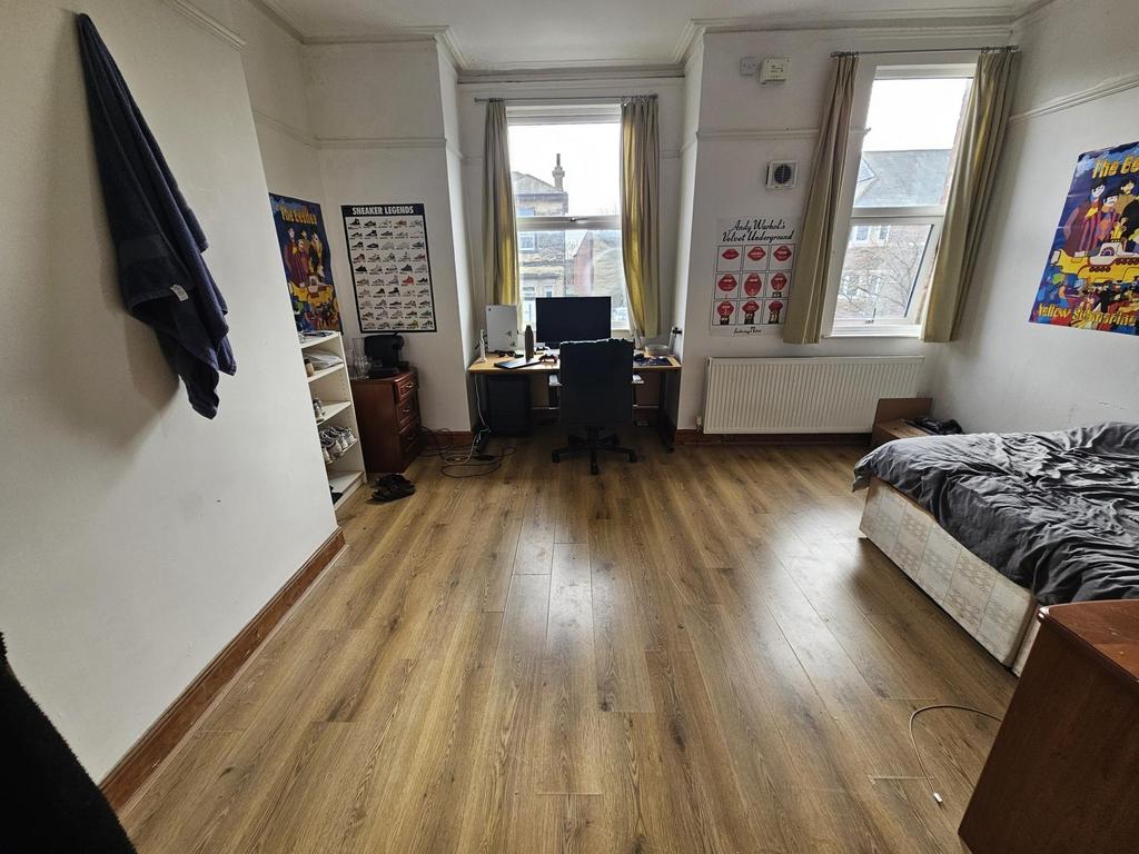 Bright, spacious bedroom with large windows...