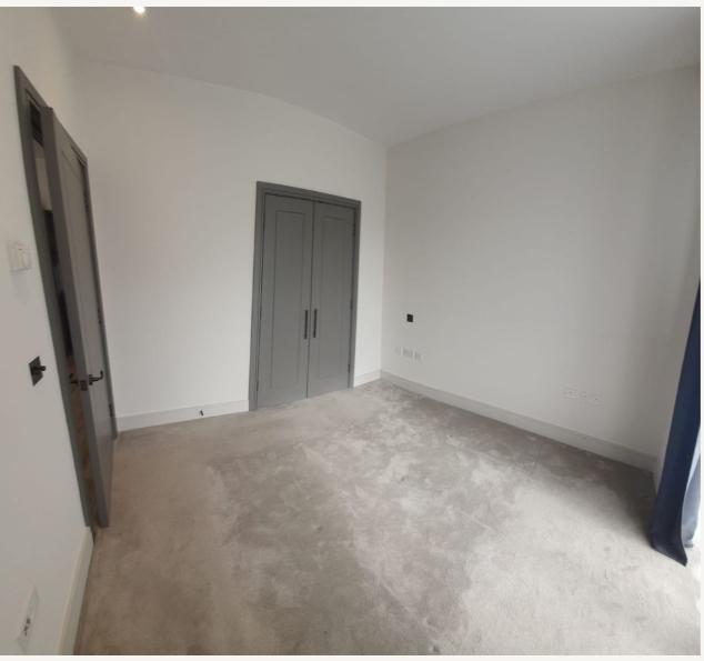 Bedroom with built-in wardrobe and private balcony