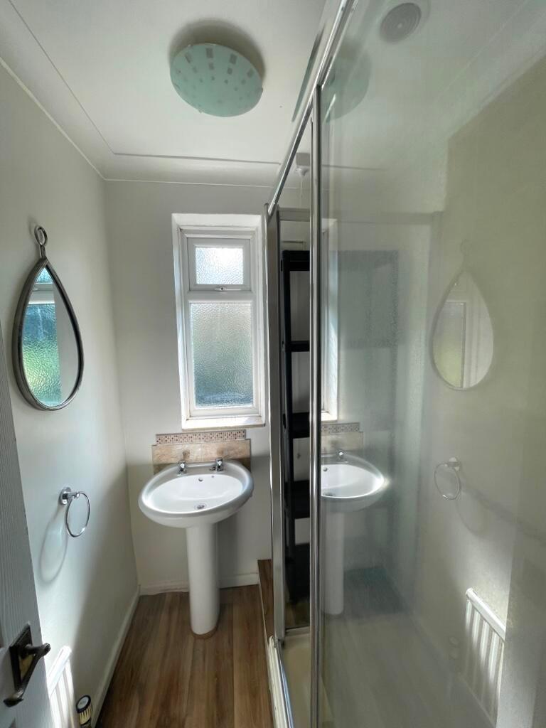 Bright, tidy bathroom with a fitted shower encl...