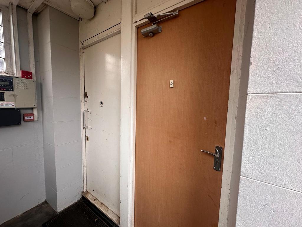 Internal entry hallway with two adjacent doors,...