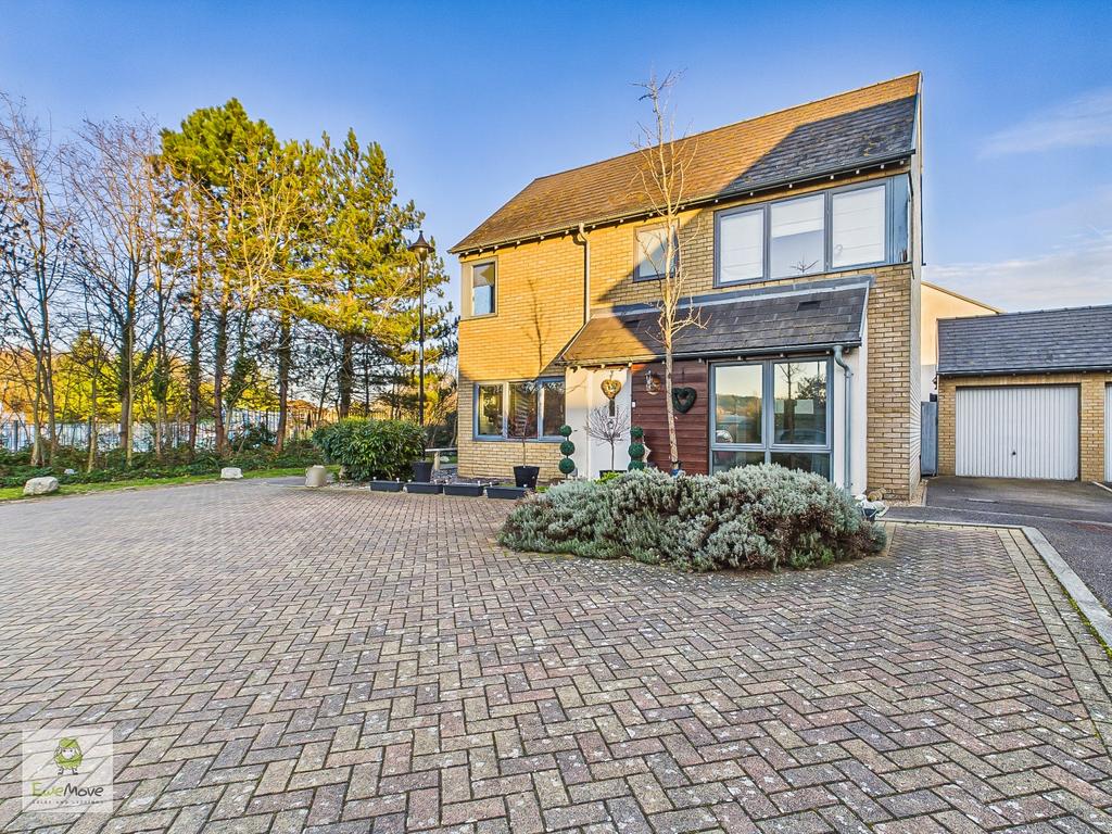 View Of Property With Drive And Garage