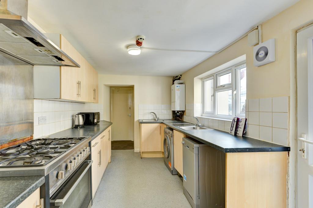 Bright galley kitchen with a large gas cooker, ...
