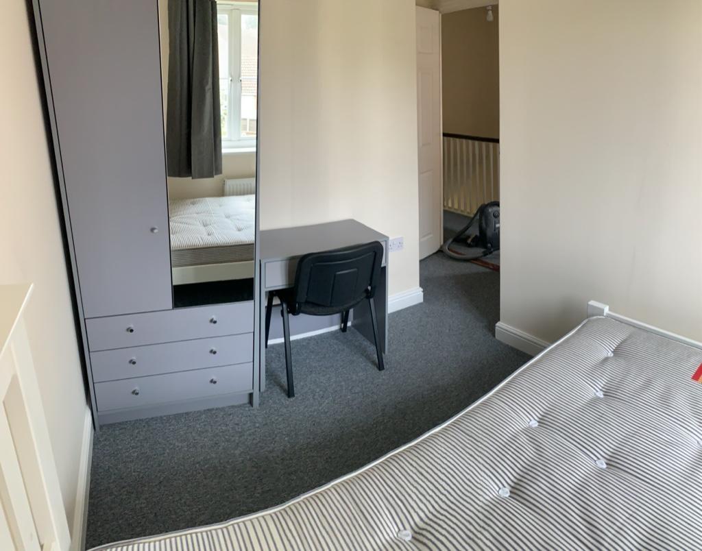 Bright, neatly presented bedroom with a double ...
