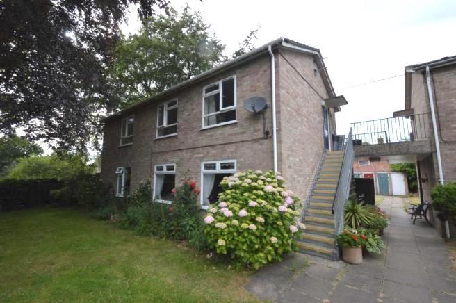 Brick two-storey property with external stairca...