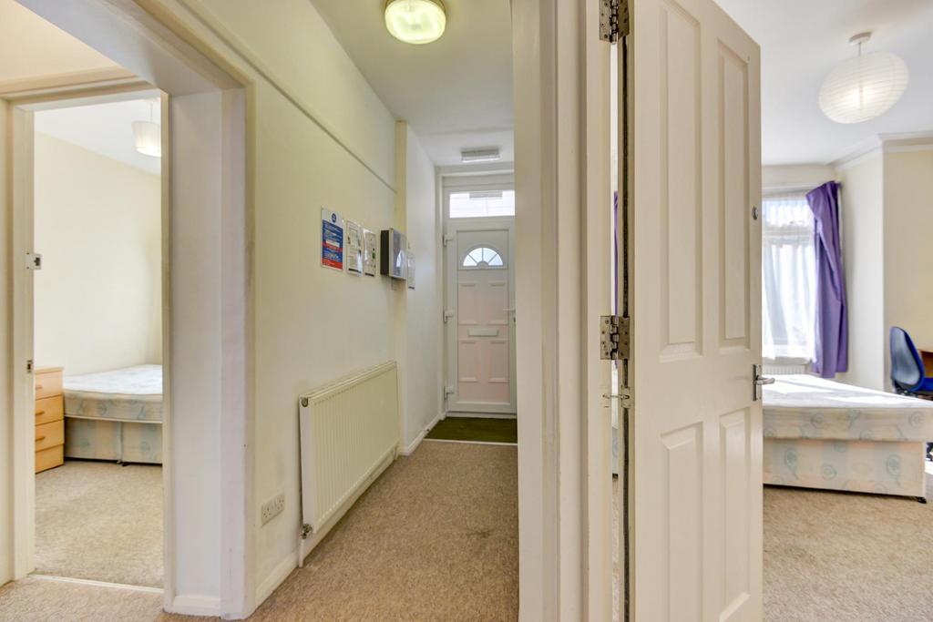 Bright, neutral hallway with access to adjacent...