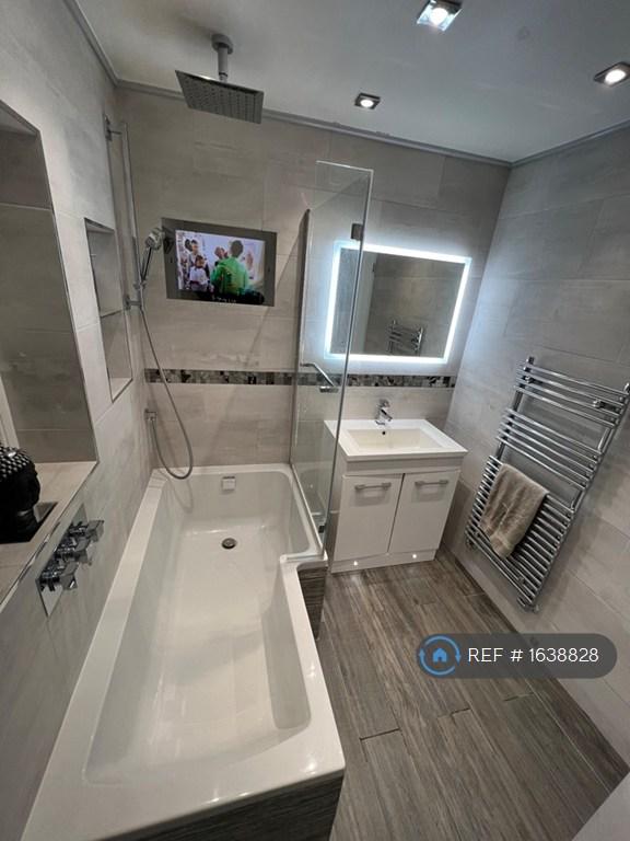 Bathroom With Tv And Mirror Light On