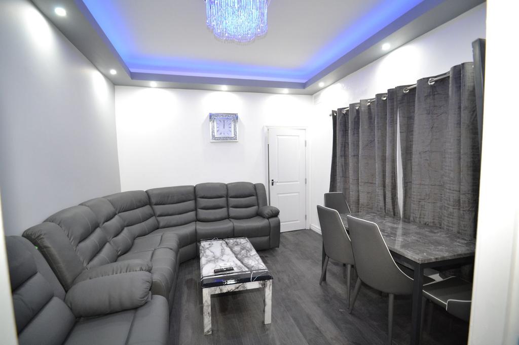 Modern and spacious living room featuring a lar...