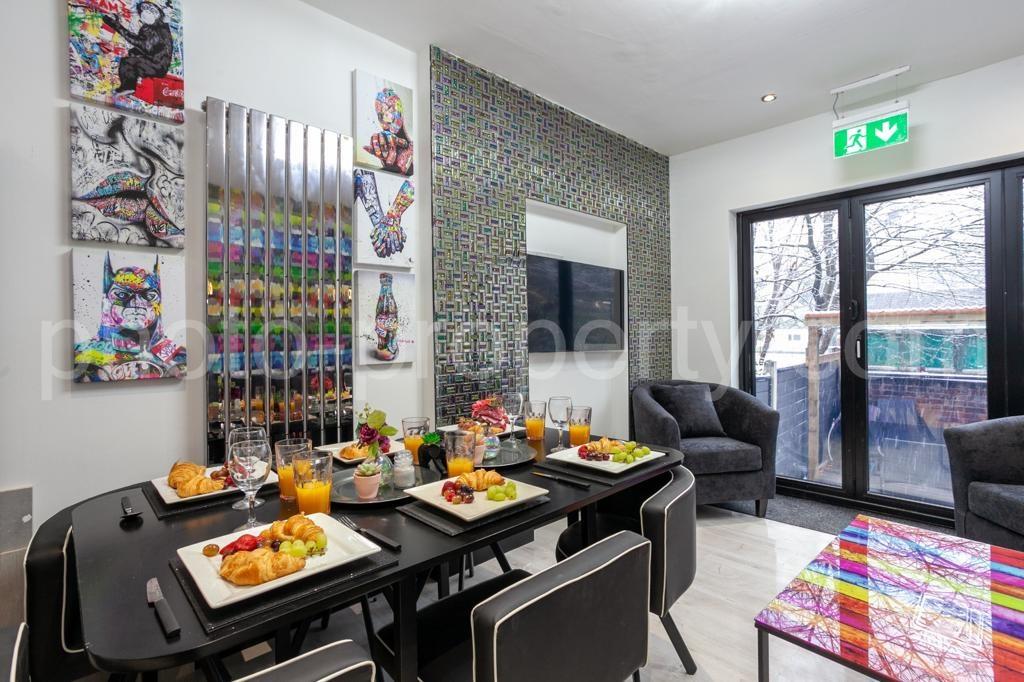 Bright, modern communal lounge and dining area ...