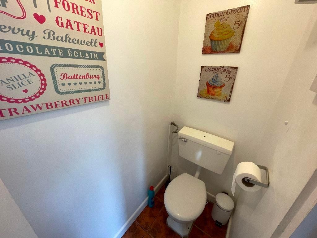 Bright, well-kept WC with simple white fittings...