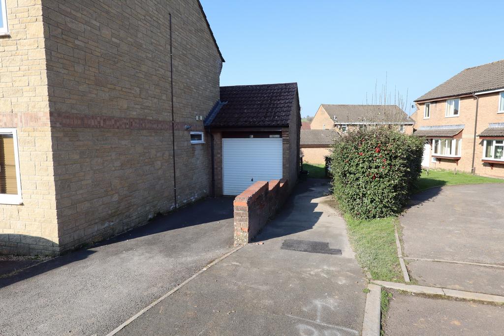 Garage and driveway (opposite the property)
