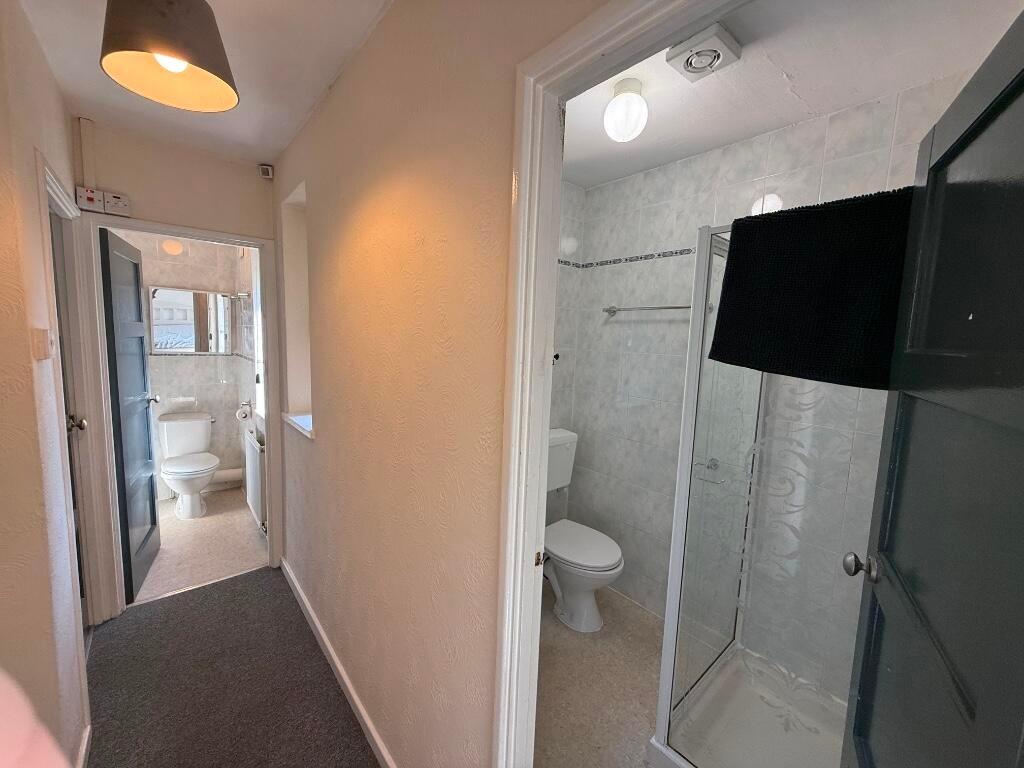 Bright, well-maintained hallway with access to ...